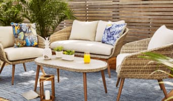 Byward 4-piece set with a loveseat and 2 armchairs with grey cushions, and a coffee table on a blue rug