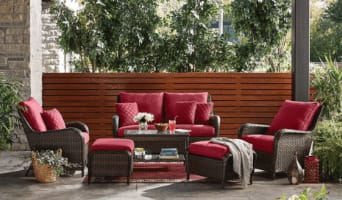 Rosedale 6-piece conversation set with a loveseat, 2 armchairs, 2 ottomans with red cushions, and a glass-top coffee table