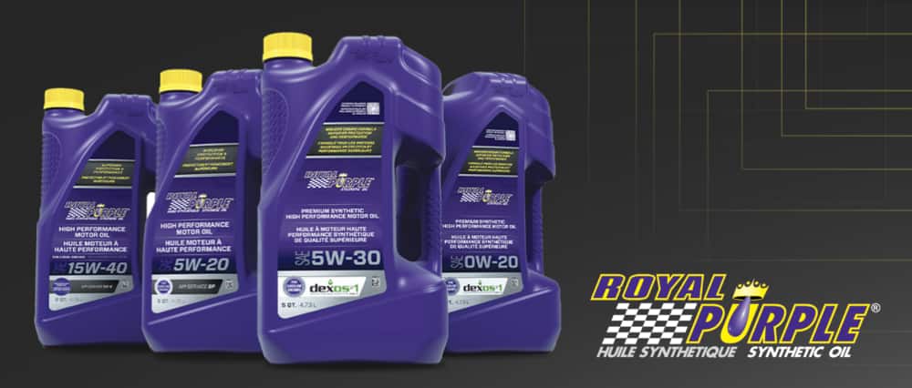 Four jugs of assorted Royal Purple Motor Oil, including 5W-20, 5W-30, 15W-50 and 0W-20 formulations.