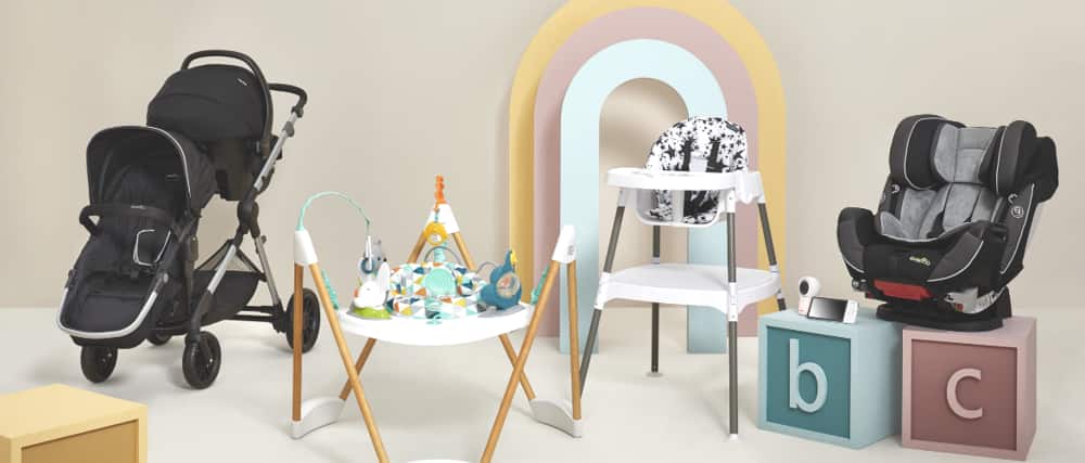 A high chair, infant car seat, baby monitor and activity centre are displayed.