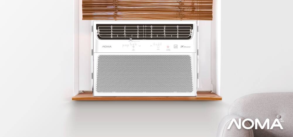 Frontal shot of a NOMA Premium Design 4-in-1 ENERGY STAR® Window Air Conditioner on a windowsill.
