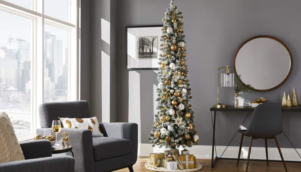 Bennet Flocked 7-ft Pencil Tree in a modern sitting area.