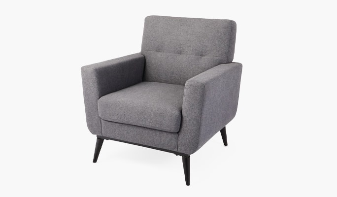 Light grey upholstered cushioned accent chair