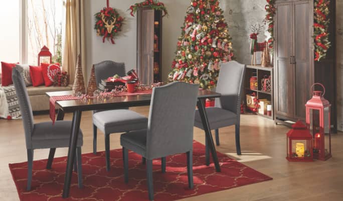 A home dining area decorated with red-themed decor for Christmas.