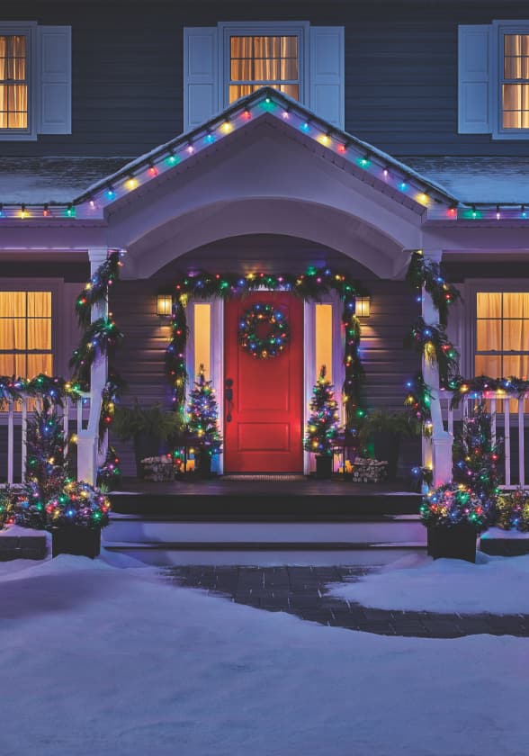 NOMA colourful Christmas string lights decorating the entrance of a home.