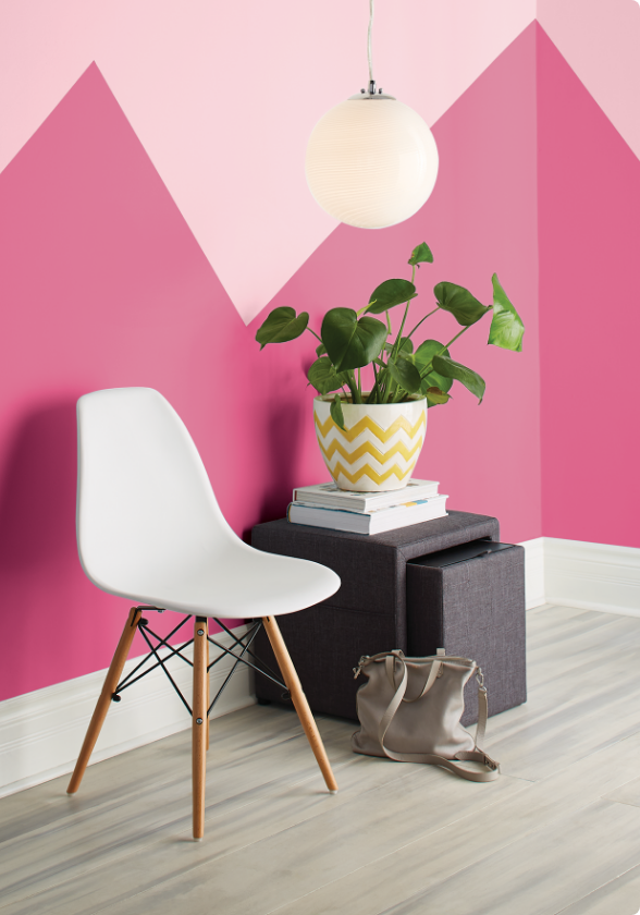 A two-tone wall with zig-zag pattern painted in fuchsia and salmon pink.