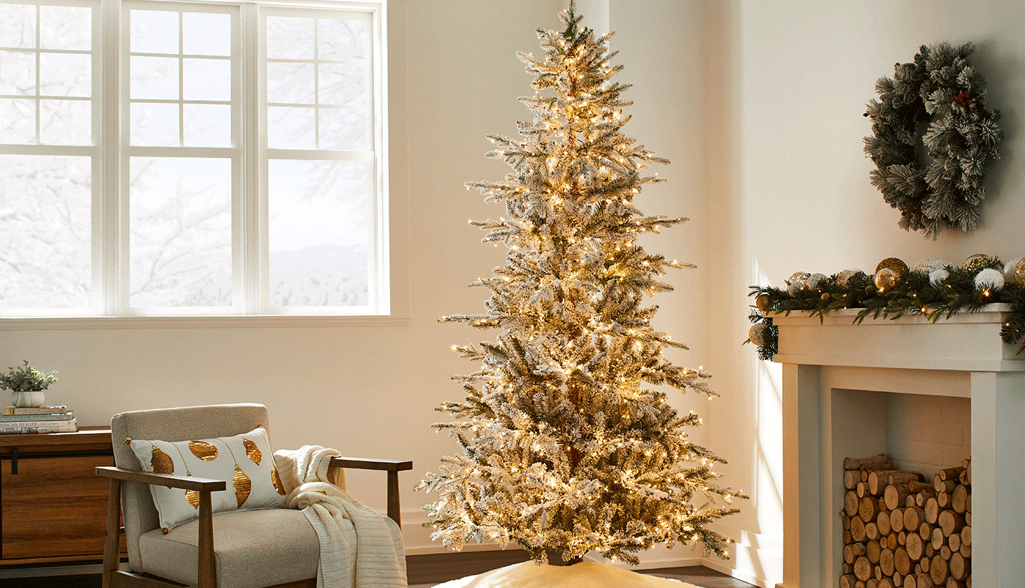 NOMA 7.5 Glisten Flocked Tree in a contemporary living room decorated for Christmas.