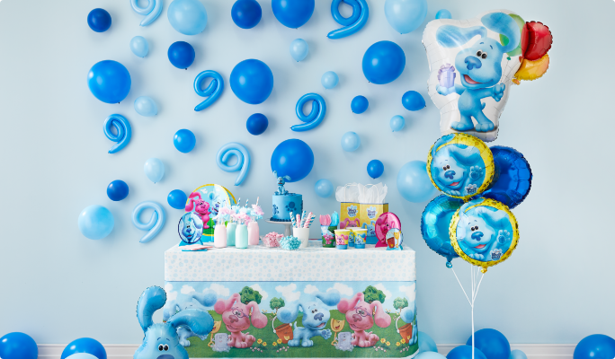 A table decorated with blue balloons