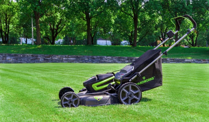 Lawn mower on a grass field. 