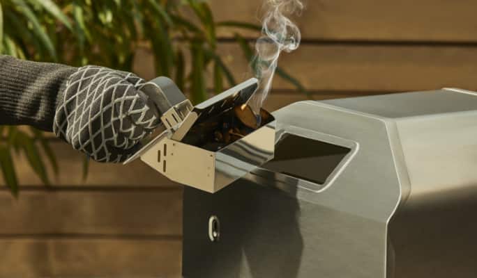 Close up of WoodFUSION integrated smoker box on Vida by PADERNO Gas Pizza Oven.