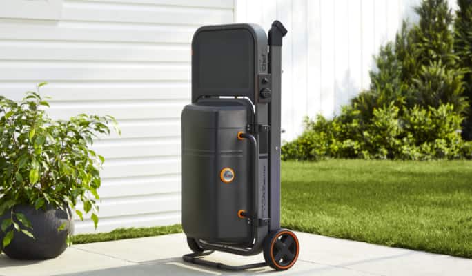 MASTER Chef® Portable BBQ compact holding cart in backyard. 