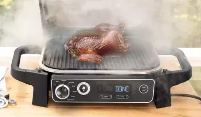 Ninja Woodfire™ Electric BBQ using smoking feature. 