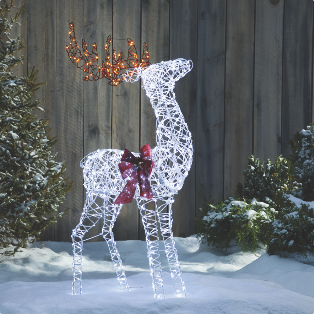 Lit up Micro-Brite 4-ft Deer on a snowy lawn.