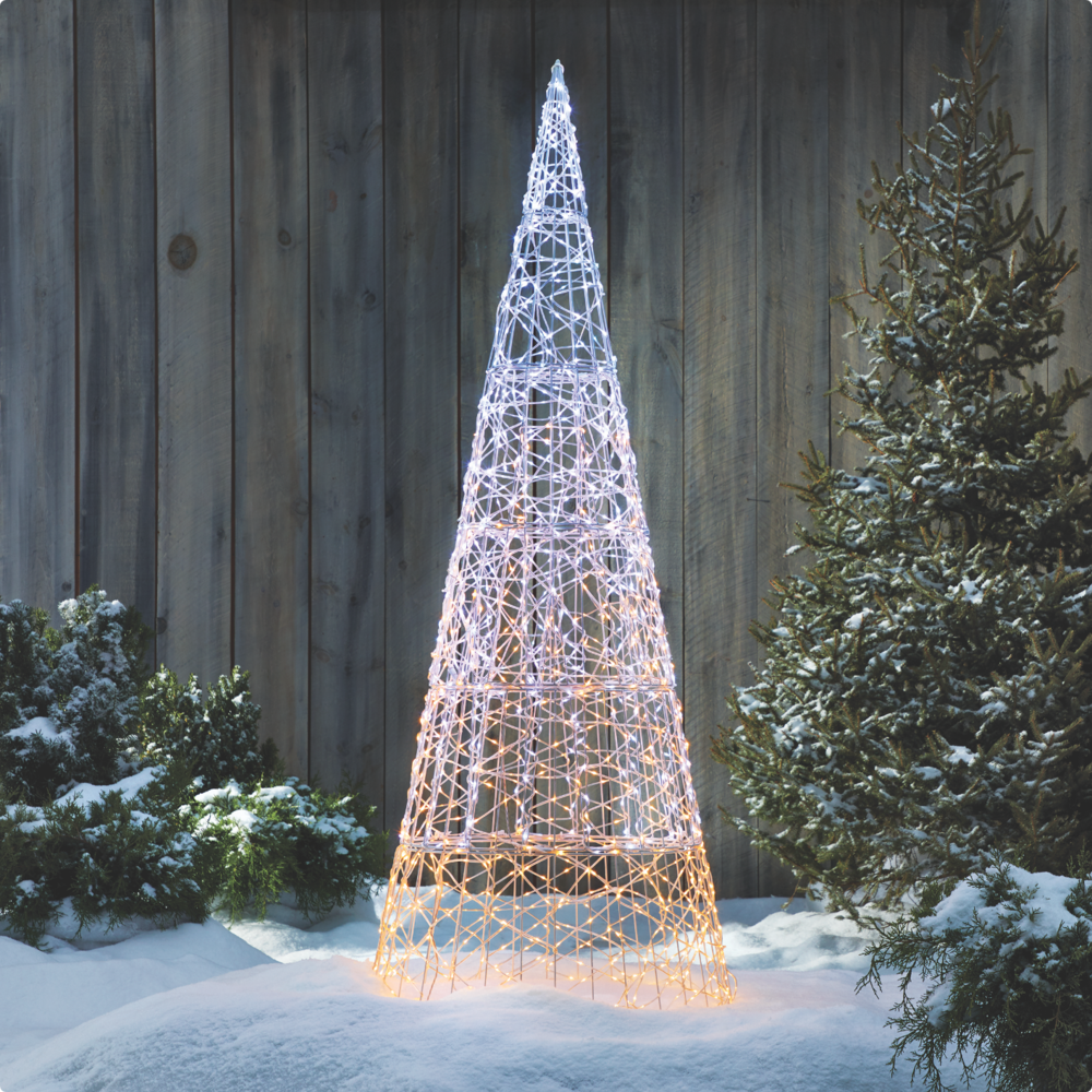 Lit up Micro-Brite 6-ft Twinkling Cone Tree on a snowy lawn.