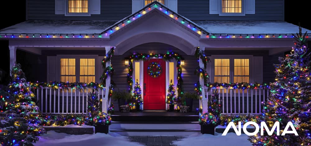  The exterior of a home decorated with colourful NOMA Advanced EverTough LED Lights.