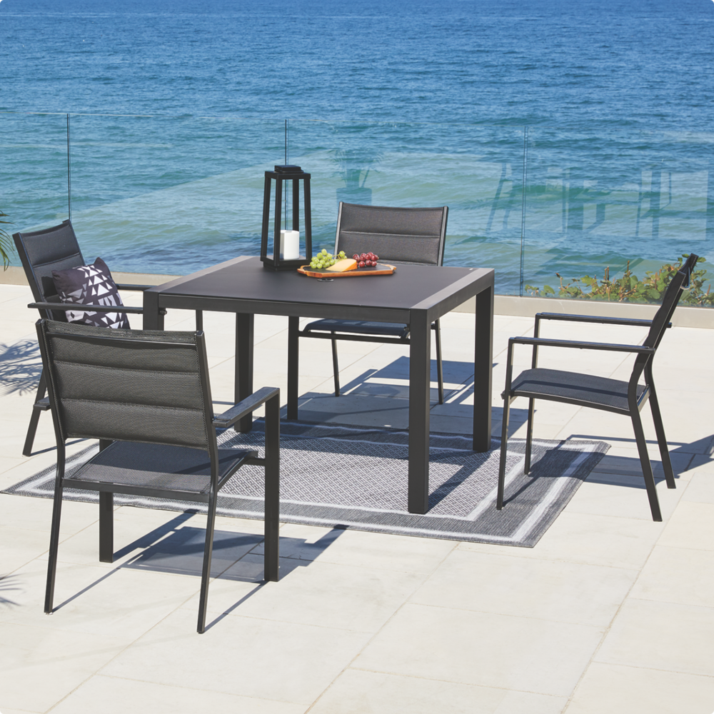  CANVAS Mercier Square Dining Table set up on lakeside patio balcony with 4 chairs and dining table. 