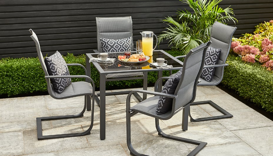 Black four chair and table patio set