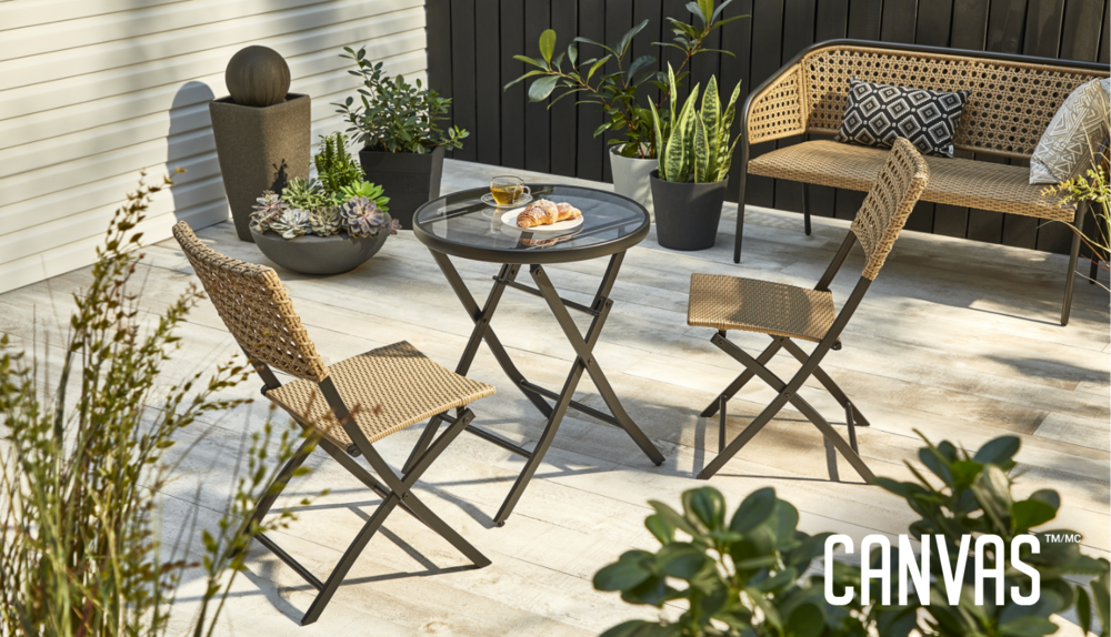  CANVAS Chambly Collection set up outdoors surrounded by plants and decorative cushions.