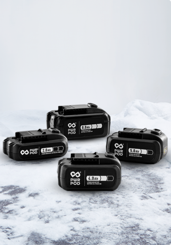 Product shot of four PWR POD battery systems in snowy background.