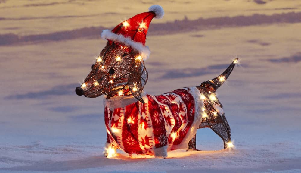 CANVAS 2-ft LED Whimsical dachshund on a snowy lawn.