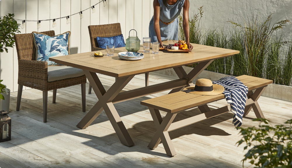 Bellwoods dining collection set up with blue cushions. 