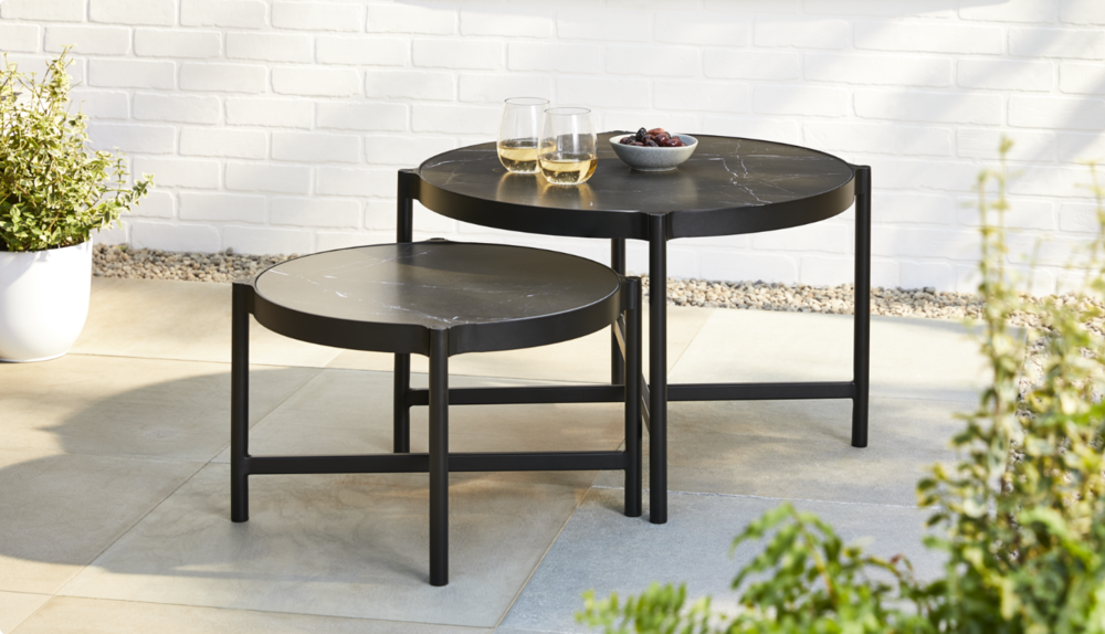 Jasper nesting tables in backyard.