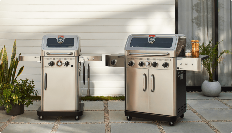 Two Vida by PADERNO BBQs on an outdoor patio.   