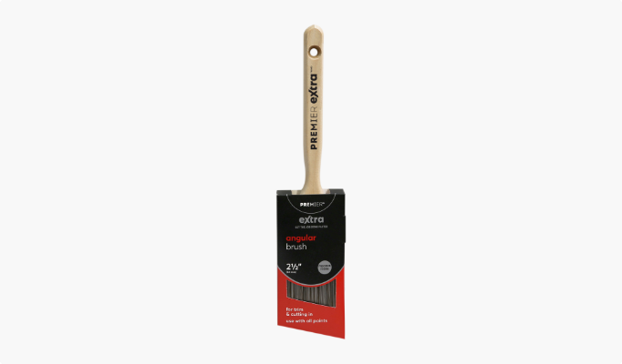 A Premier Extra wide angled paint brush with wooden handle.