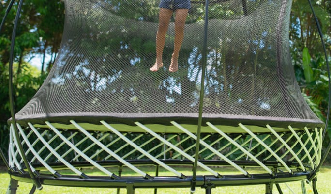 Child jumping on a trampoline