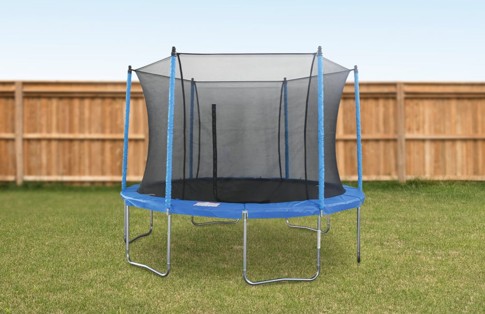 A trampoline with surrounding net set up on a backyard lawn.