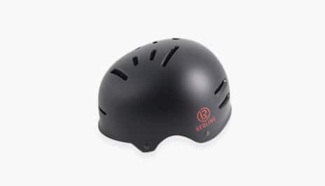 A black Redline bicycle helmet.