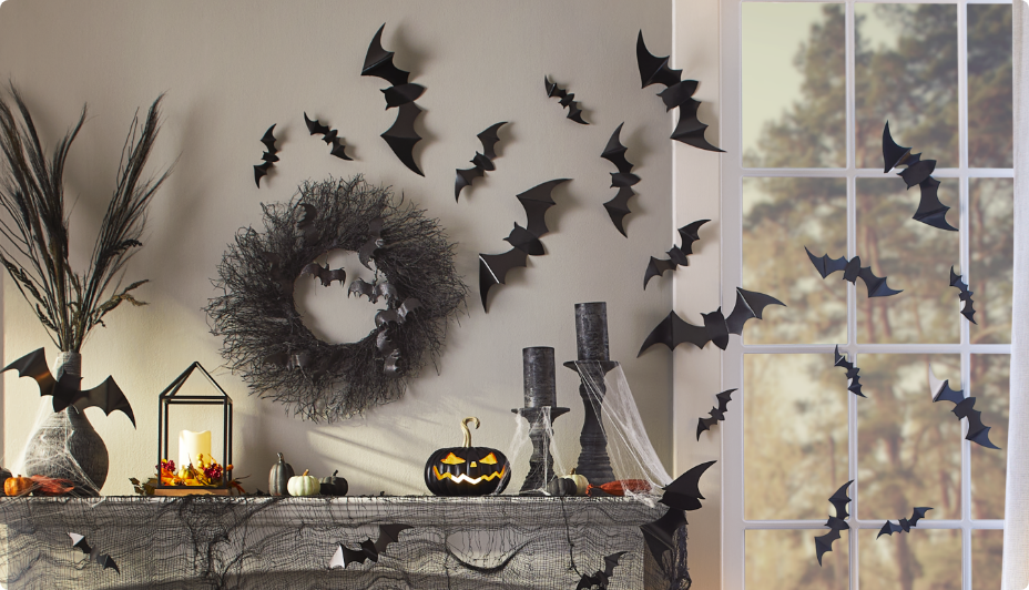 Bat decals, fall gourds and a harvest wreath decor the inside an entryway