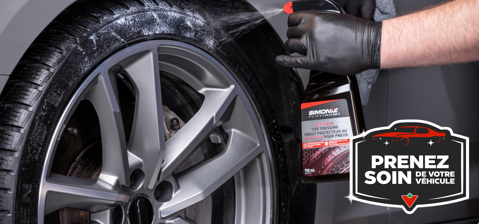 A spray bottle of SIMONIZE Graphene Tire Dressing is applied onto a freshly-washed tire.