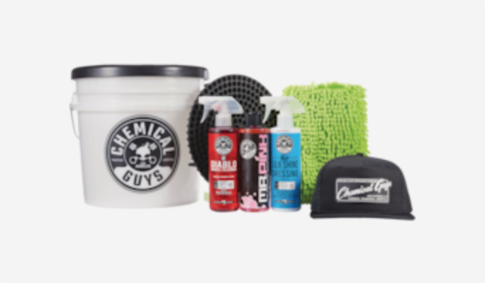 A selection of Chemical Guys tire and rim cleaners, 4-gallon pail, and drying towel.
