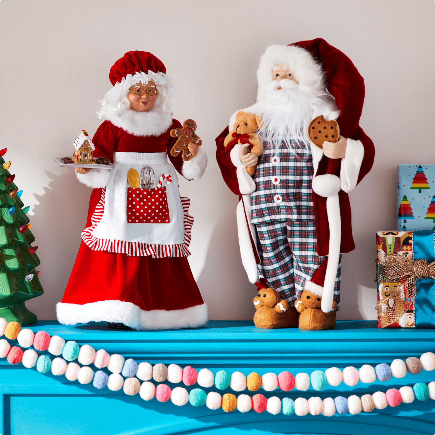 Santa and Mrs. Claus decor on mantel. 