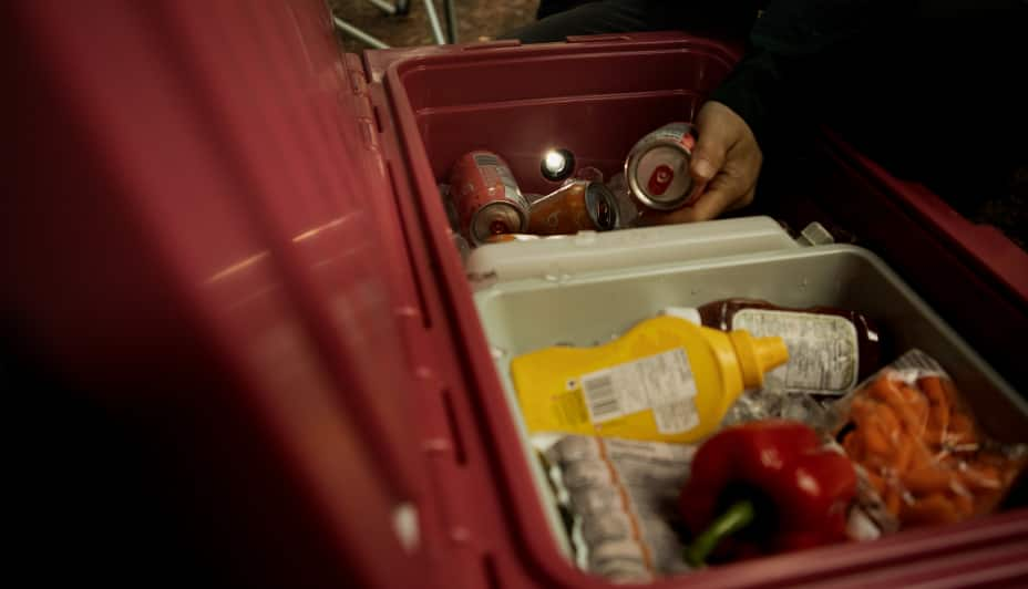 Condiments and drinks inside a Woods cooler