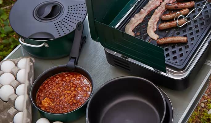Breakfast cooking on camping cooking equipment 