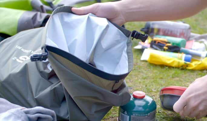  Person packing a camping pack  