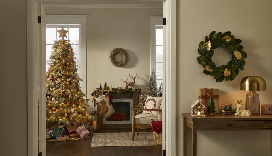 Living room decorated with Christmas tree and CANVAS Christmas decor