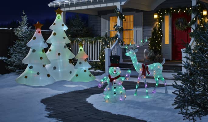 NOMA Advanced Smart Christmas decorations on snowy lawn
