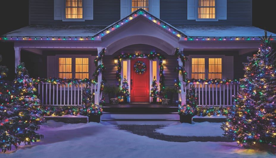 Exterior of home decorated with colourful Christmas lights