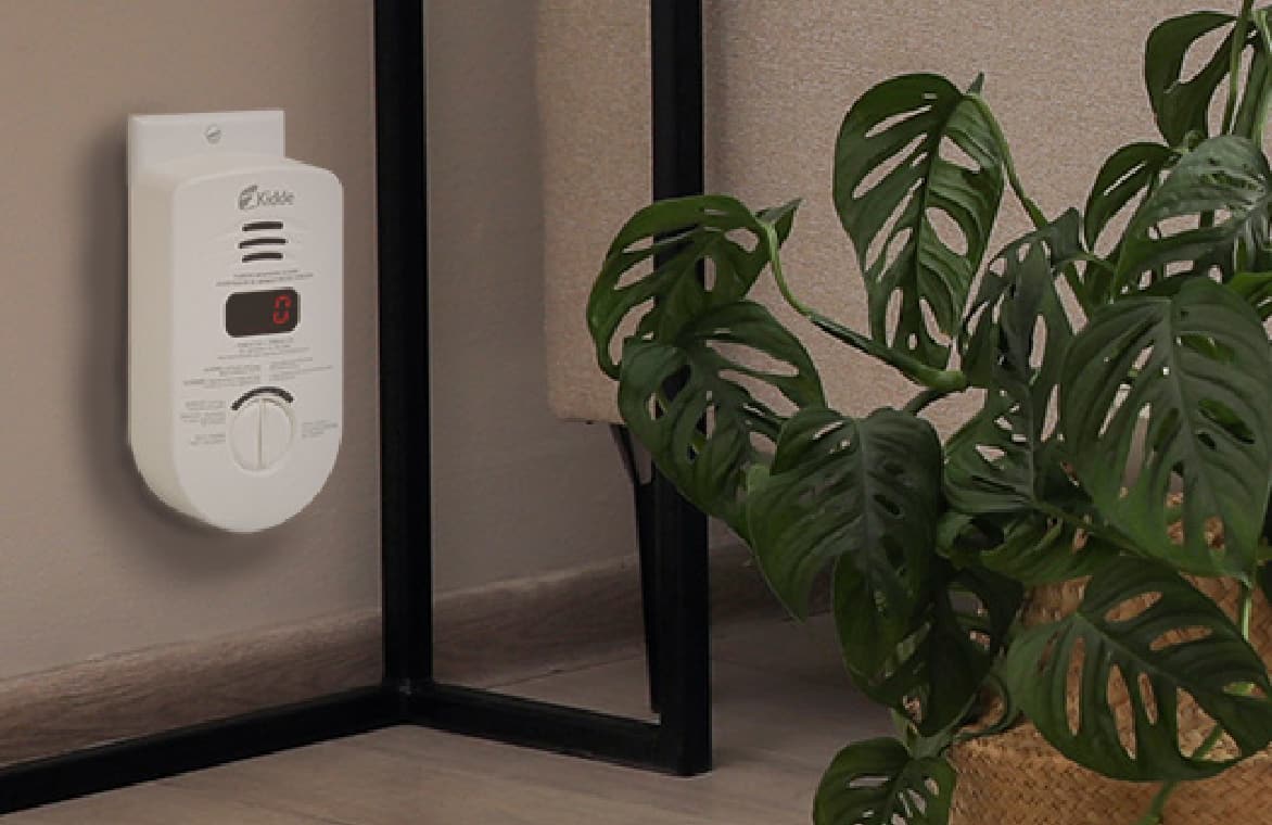 Carbon monoxide alarm plugged in near floor 