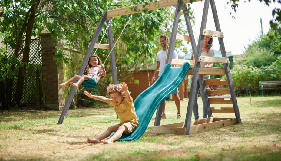 Kids playing on an outdoor playset