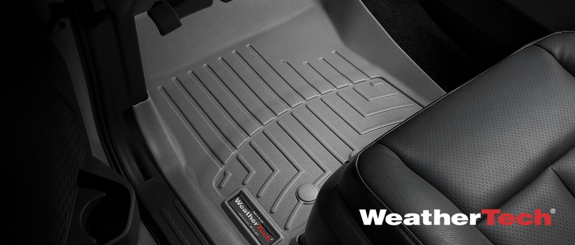 A grey WeatherTech FloorLiner installed on the driver’s-side floor of a car.
