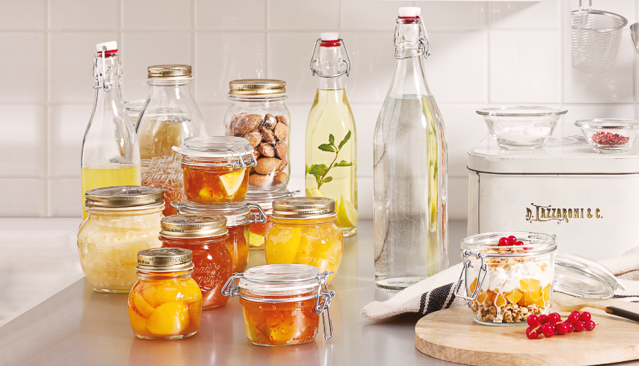 Canning jars filled with preserved fruits and pickled vegetables