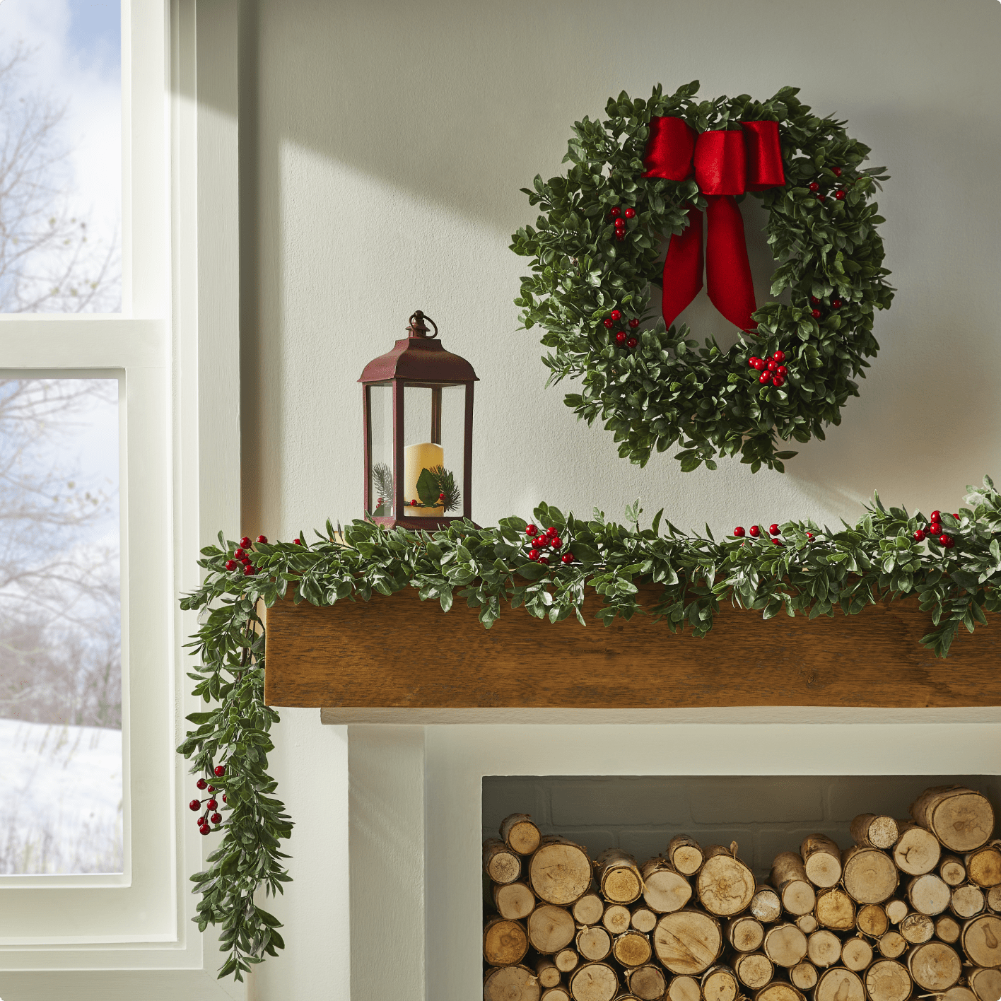 Mantel decorated with CANVAS Boxwood wreath and garland