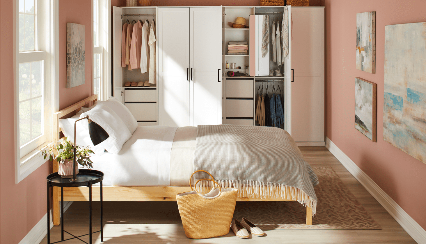Light pink and white bedroom with closet organizers. 