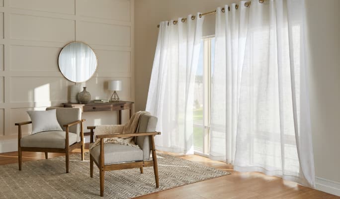 Windows with sheer white curtains.