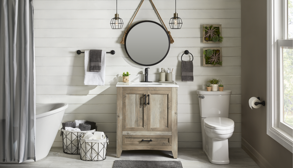 An Images 2000 Inc Round Rope Wall Mirror hangs in a white, rustic-look bathroom.
