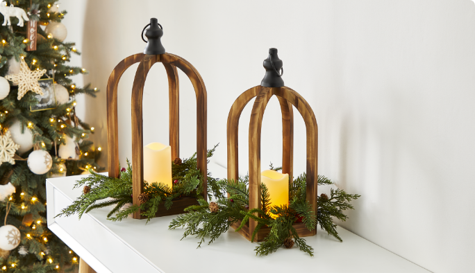 CANVAS wood lanterns and candles on a mantel